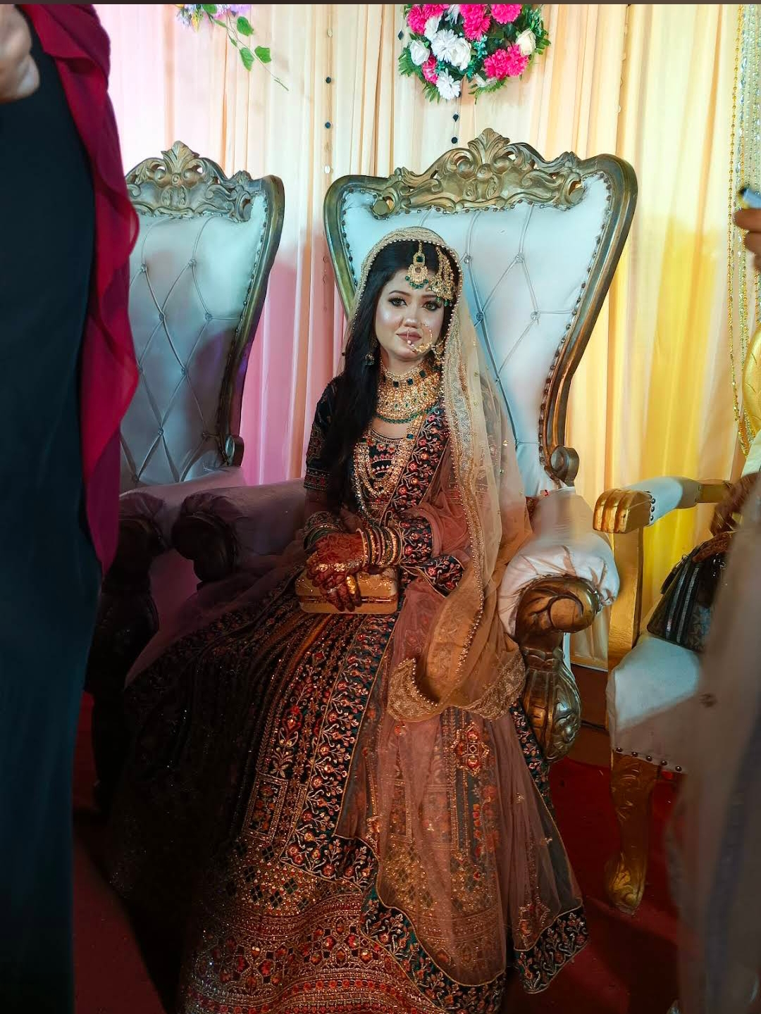 Full bridal look on royal throne chair
